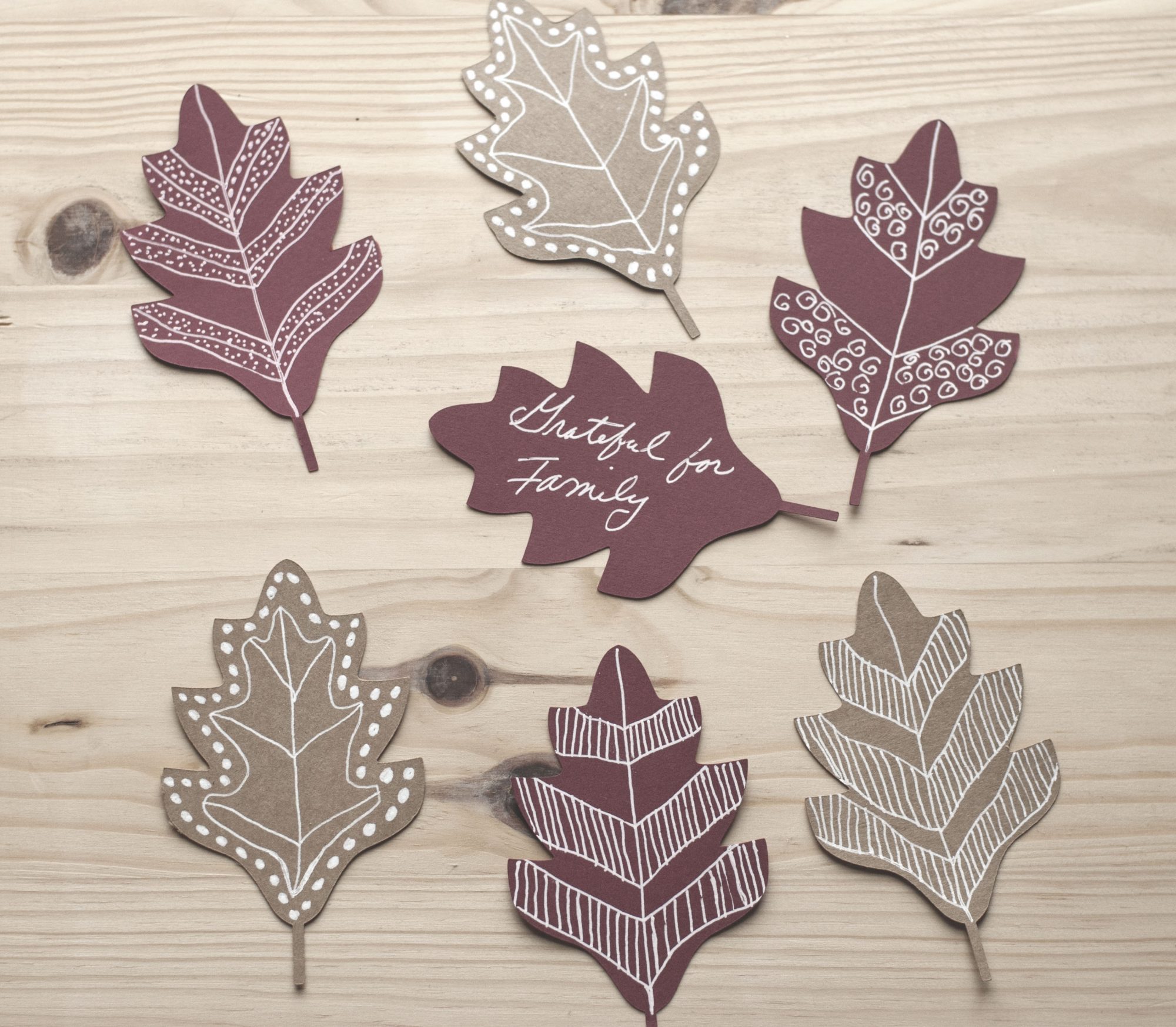 paper leaves decorated with doodle art