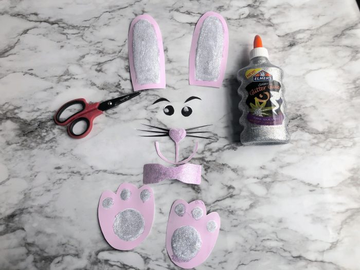 Easter Bunny Lunch Bag paper bunny parts and Elmers silver glitter glue