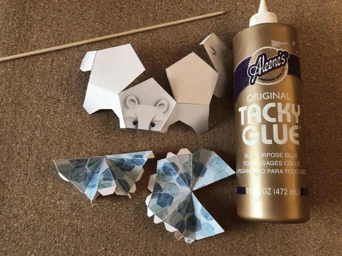 scored and folded paper bear pieces plus bottle of glue