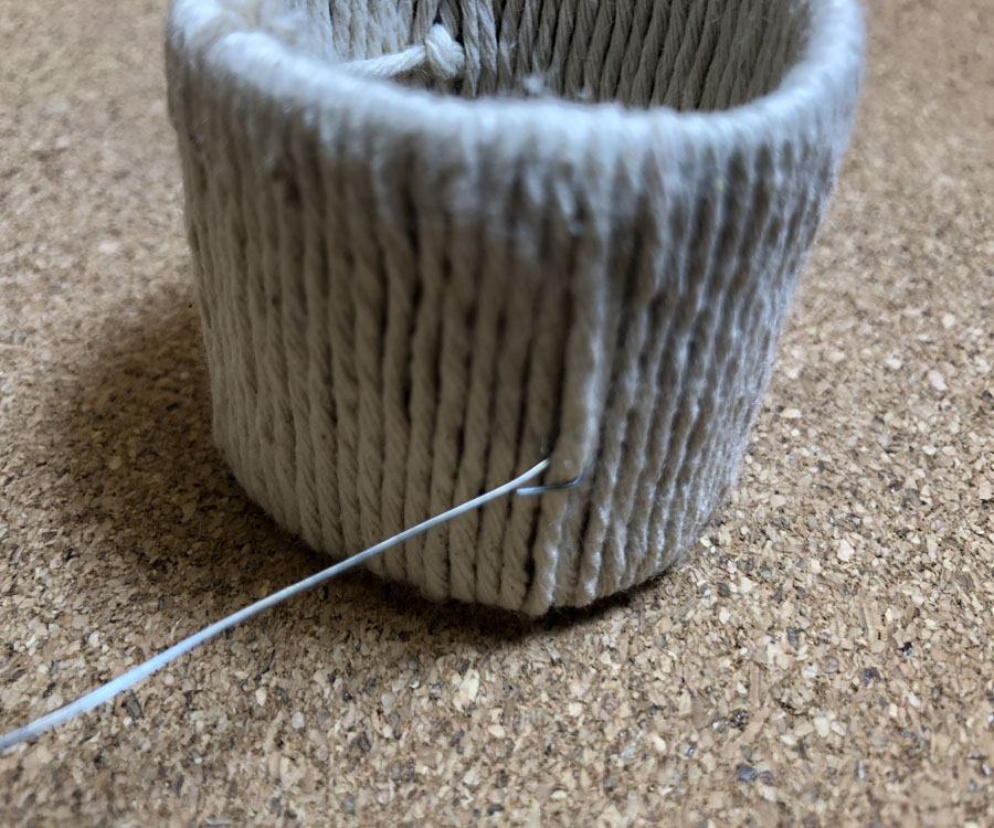 beading wire hooked onto paper tube napkin ring