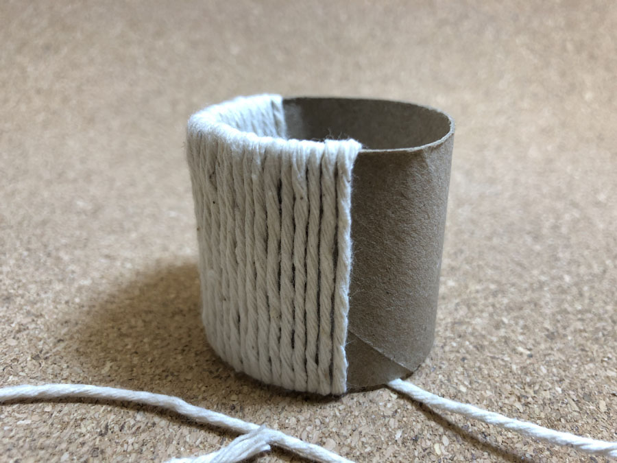 twine wrapped around paper tube napkin ring